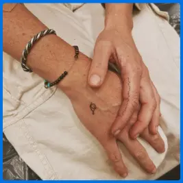 finger tattoo for older woman